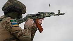 A volunteer soldier attends a training outside Kyiv, Ukraine, Saturday, Aug. 27, 2022.