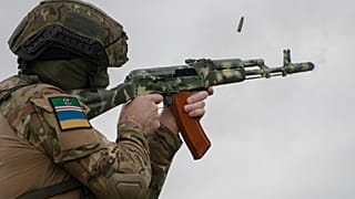 A volunteer soldier attends a training outside Kyiv, Ukraine, Saturday, Aug. 27, 2022.