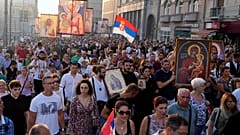 People march during a protest against the international LGBT event EuroPride in Belgrade, Serbia, Sunday, Aug. 28, 2022. 