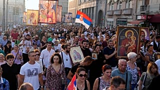 People march during a protest against the international LGBT event EuroPride in Belgrade, Serbia, Sunday, Aug. 28, 2022.