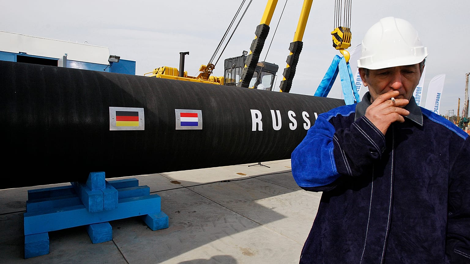 A Russian construction worker smokes in Portovaya Bay some 170 kms north-west from St Petersburg, 9 April 2010