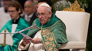 Pope Francis speaks to cardinals in St. Peter's Basilica at The Vatican during a mass he celebrated for the newly-created cardinals, 30 August 2022