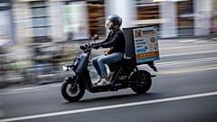 A delivery man rides a scooter in Paris, France, Tuesday, Aug. 23, 2022.