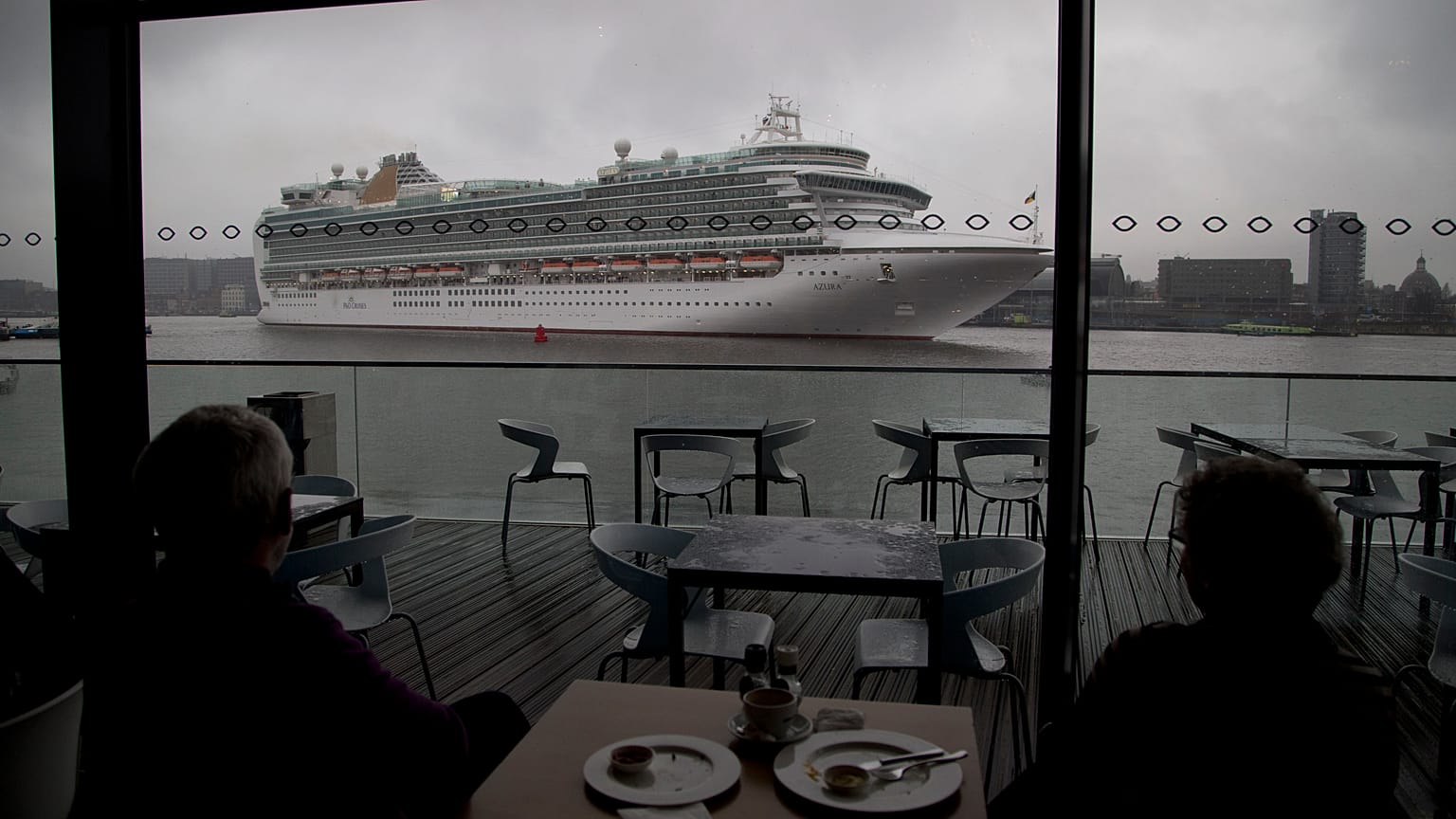 An Italian cruise ship is pictured leaving the port of Amsterdam in the Netherlands.