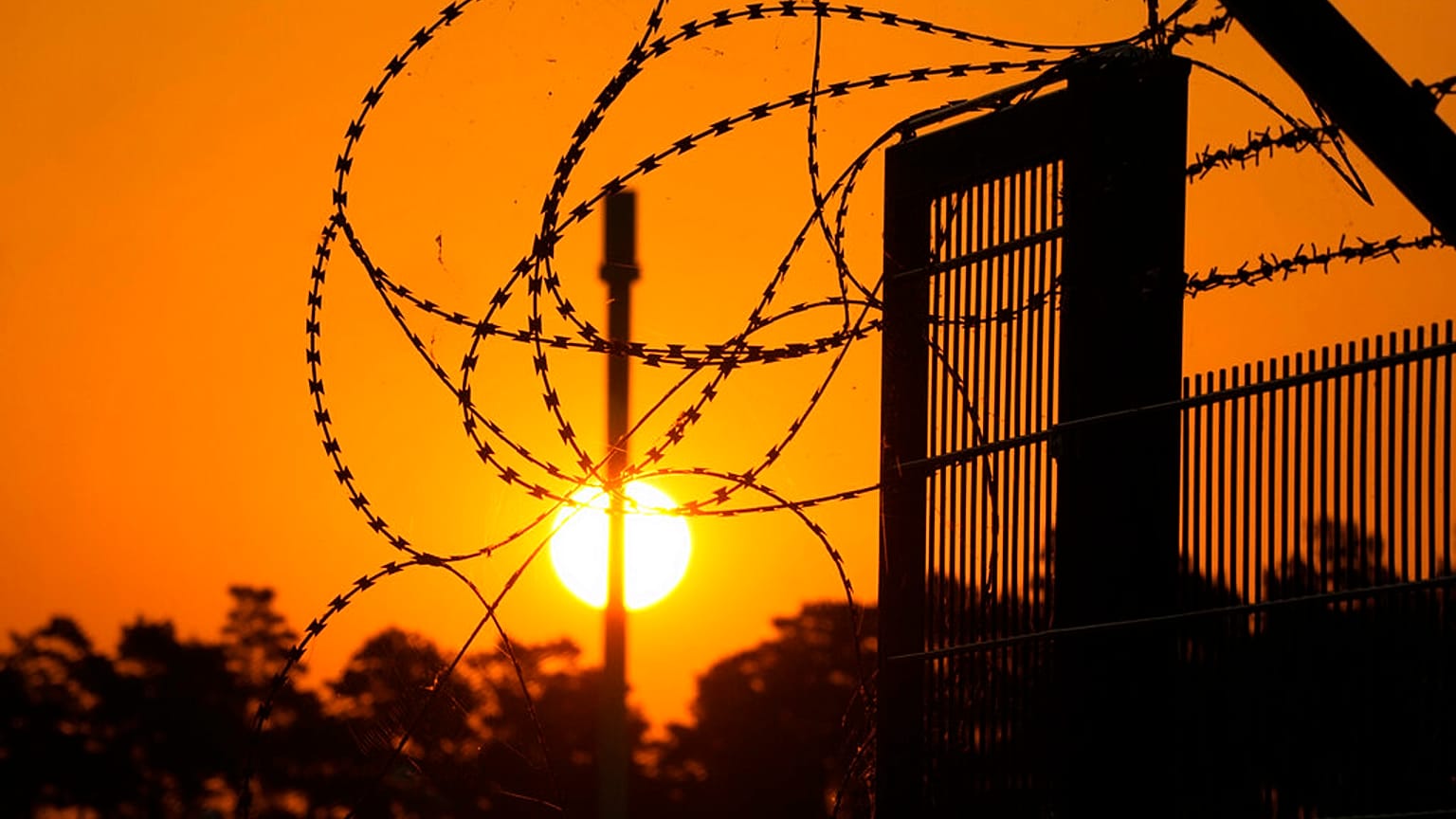 Barbed wire secures the entrance of the harbour area where the landfall of the Nord Stream 1 Baltic Sea pipeline is located, Thursday, 21 July, 2022.