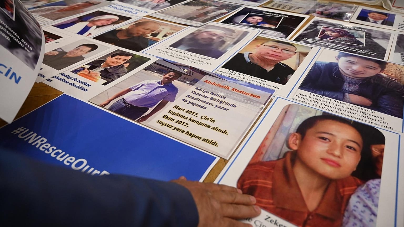 FILE: Members of Muslim Uyghur minority present pictures of their relatives detained in China during a press conference in Istanbul, on May 10, 2022. 