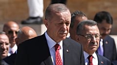 Recep Tayyip Erdogan and other officials walk to the mausoleum of modern Turkey's founder Mustafa Kemal Ataturk on Victory Day, 30 August 2022