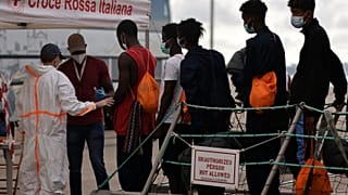 Migrants arrive in Italy after being rescued in Mediterranean sea by volunteers