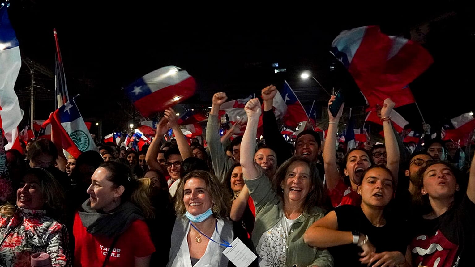 Opponents of the new proposed constitution celebrate in the streets after the results. 