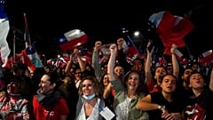 Opponents of the new proposed constitution celebrate in the streets after the results. 