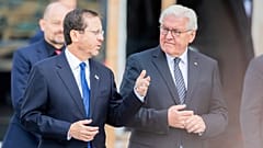 Israeli President Isaac Herzog, left, and German President Frank-Walter Steinmeier, right.