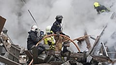 Ukrainian firefighters work among debris from destroyed buildings after the latest Russian rocket attack in center Kharkiv, Ukraine, Tuesday, 6 September, 2022.