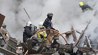 Ukrainian firefighters work among debris from destroyed buildings after the latest Russian rocket attack in center Kharkiv, Ukraine, Tuesday, 6 September, 2022.