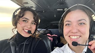 Mia (left) and her sister flying together in Greenland