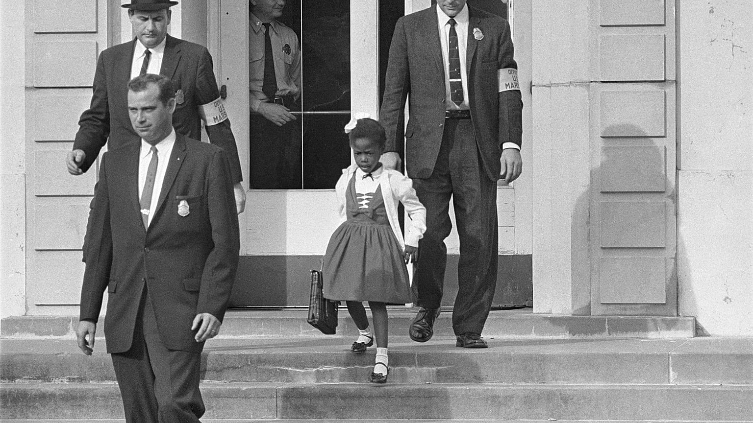 U.S. Deputy Marshals escort 6-year-old Ruby Bridges from William Frantz Elementary School in New Orleans, in this November 1960