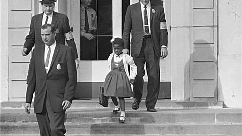 U.S. Deputy Marshals escort 6-year-old Ruby Bridges from William Frantz Elementary School in New Orleans, in this November 1960