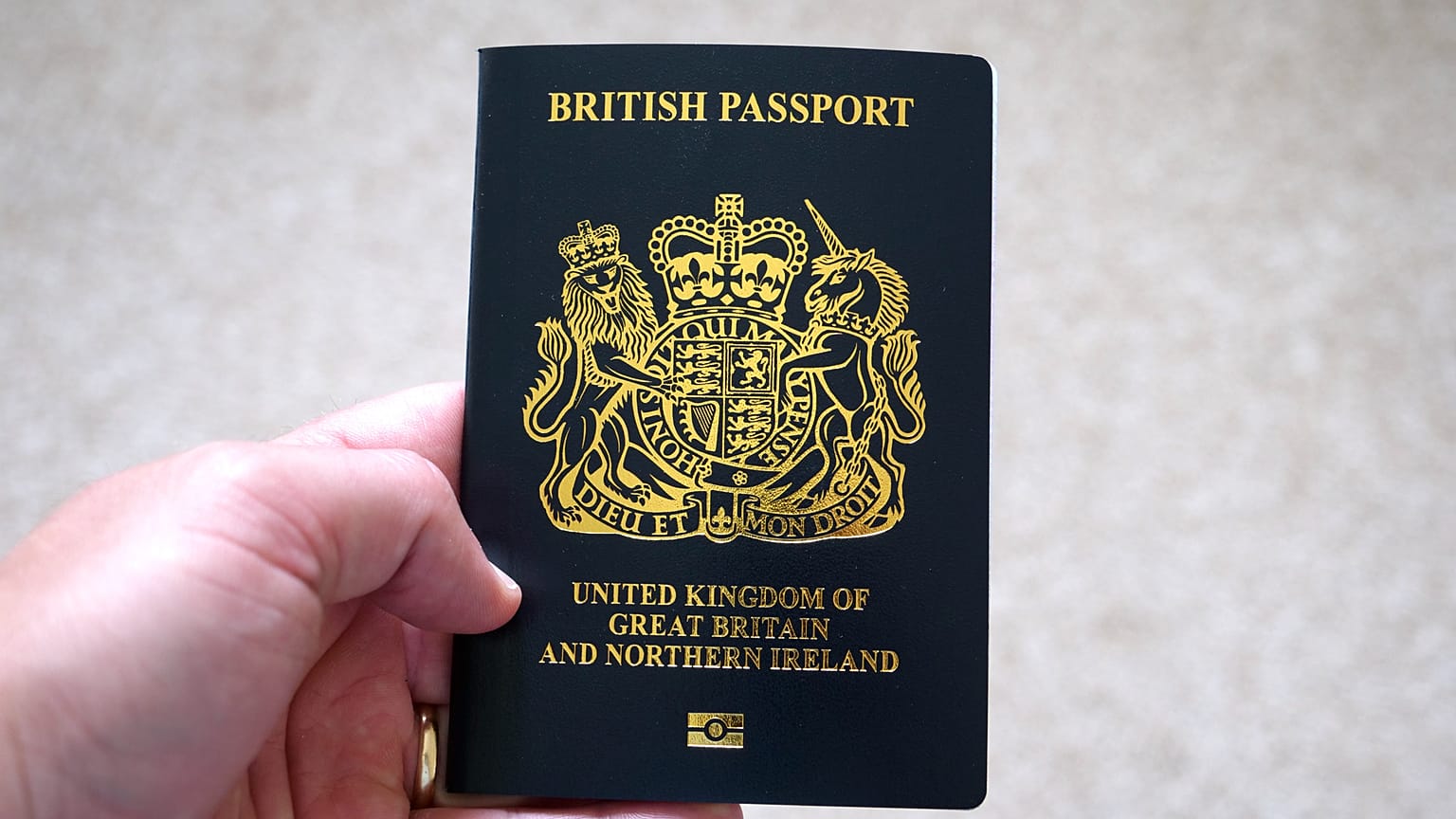 Wording inside the front of British passports mentions Her Majesty the Queen.