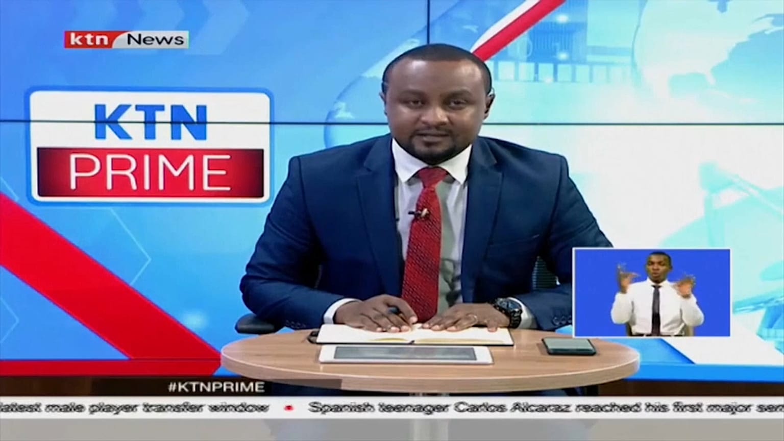 A KTN presenter breaking the news that Queen Elizabeth II had died. 