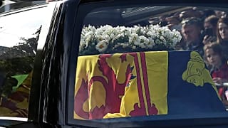 The hearse carrying the coffin of Queen Elizabeth II, draped with the Royal Standard of Scotland, 11 September 2022