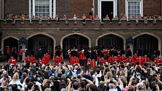 Members of the public listen to the proclamation following the Accession Council ceremony at St James's Palace. 