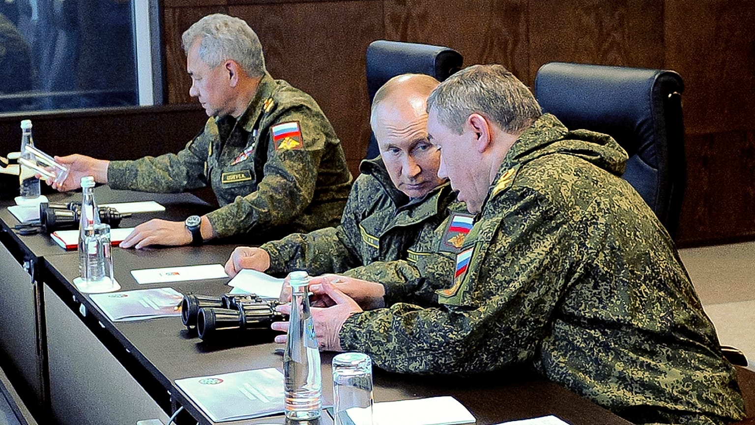 Russian President Vladimir Putin speaks to General Staff chief, Gen. Valery Gerasimov during the Vostok 2022 military exercises on 6 September 2022