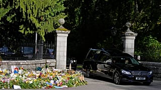 Queen Elizabeth II’s flag-draped coffin leaves Balmoral Castle