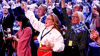 Supporters of the Sweden Democrats reacts on the results of the exit polls at the party's election watch near Stockholm, 11 September 2022