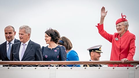 Danish Queen Margrethe, together with guests, waves on departure with the Royal Yacht Dannebrog in Copenhagen.