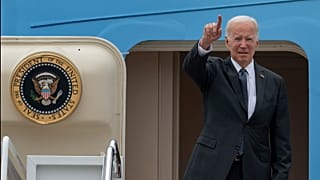 President Joe Biden gestures as he boards Air Force One, 12 September 2022