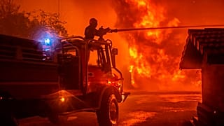 The blazes have forced the evacuation of residents amid record temperatures for September.