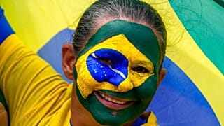 A supporter of Brazil's President Jair Bolsonaro attends a military parade commemorating the bicentennial of the country's independence in Brasilia, Brazil, 7 Sept., 2022.
