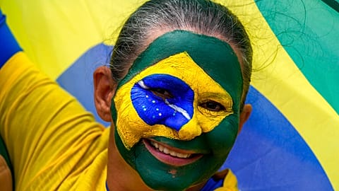 A supporter of Brazil's President Jair Bolsonaro attends a military parade commemorating the bicentennial of the country's independence in Brasilia, Brazil, 7 Sept., 2022.