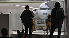 Travelers are seen at Orly aiport near Paris, France. 