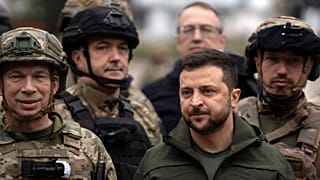 Ukrainian President Volodymyr Zelenskyy poses for a photo with soldiers after attending a national flag-raising ceremony in the freed Izium, Ukraine, Wednesday, Sept. 14, 2022