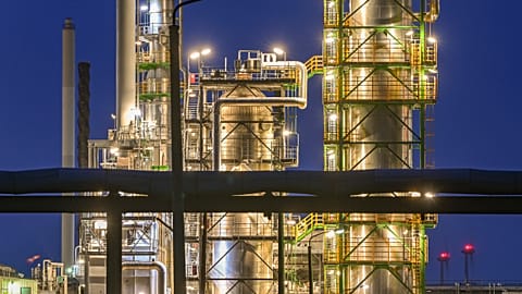 The facilities of the oil refinery on the industrial site of PCK-Raffinerie GmbH, jointly owned by Rosneft, are illuminated in the evening in Schwedt, Germany.