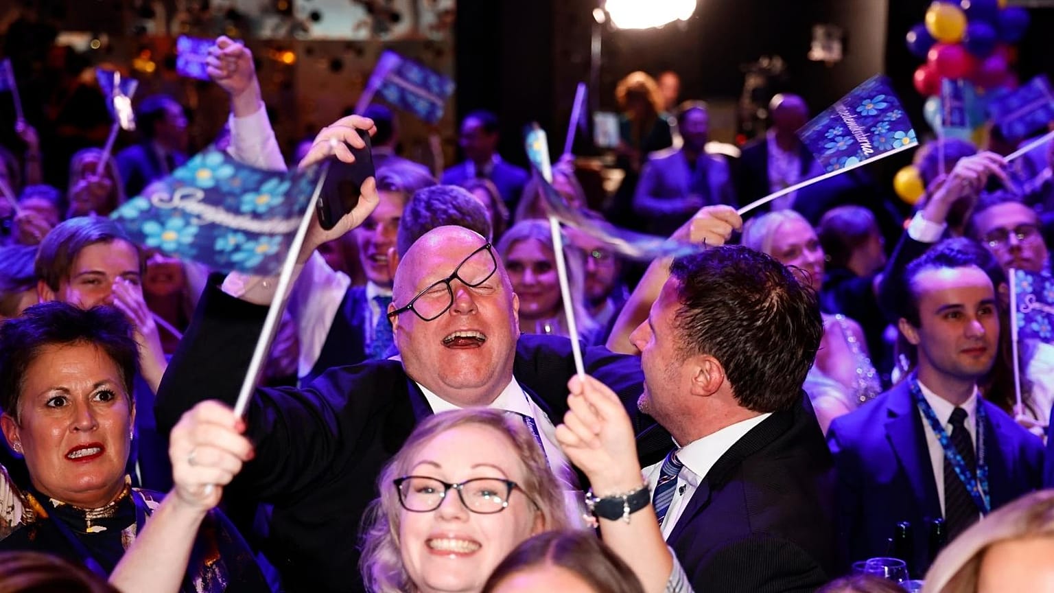 Sweden Democrats supporters celebrate a strong showing on election night, Sunday 11 September 2022, at a hotel near Stockholm