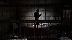 An Ukrainian serviceman stands in a basement in the retaken village of Kozacha Lopan, Ukraine, Saturday, Sept. 17, 2022.