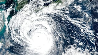 This Saturday, Sept. 17, 2022 satellite image released by NASA shows Typhoon Nanmadol, which is approaching southwest Japan.