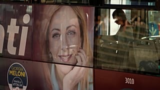 A poster of Italy's candidate premier Giorgia Meloni stands on the side of a bus in Rome, Friday, 16 September 2022.