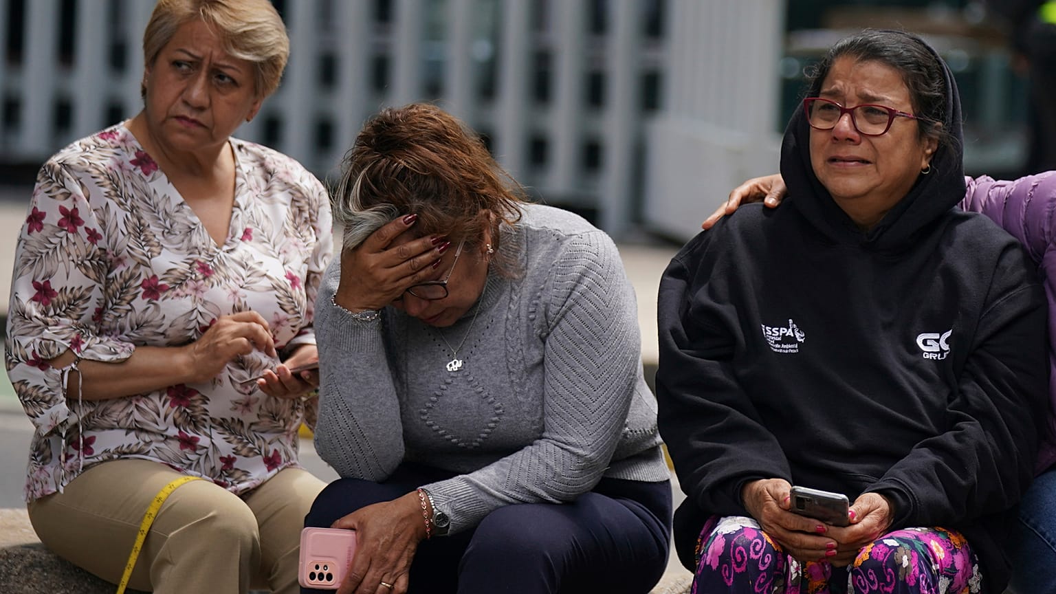 People gather outside after a magnitude 7.6 earthquake was felt in Mexico City, Monday, 19 September 2022
