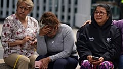 People gather outside after a magnitude 7.6 earthquake was felt in Mexico City, Monday, 19 September 2022