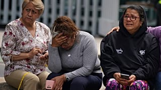 People gather outside after a magnitude 7.6 earthquake was felt in Mexico City, Monday, 19 September 2022