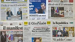 Front pages of Friday, July 22, 2022 newspapers are seen in Rome.