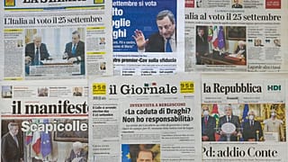 Front pages of Friday, July 22, 2022 newspapers are seen in Rome.