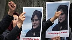 Exiled Iranians gather in protest in front of the Iranian embassy in Berlin, 20 September 2022