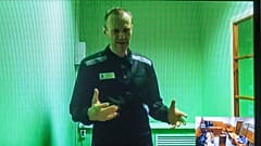 FILE - Russian opposition leader Alexei Navalny is seen on a TV screen, in video provided by Russian Federal Penitentiary Service, 4 September 2022