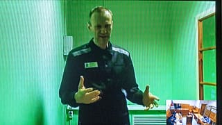 FILE - Russian opposition leader Alexei Navalny is seen on a TV screen, in video provided by Russian Federal Penitentiary Service, 4 September 2022
