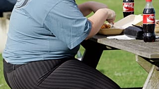 A person eats in London on 17 October 2007