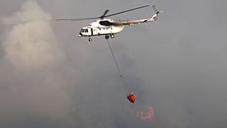 A water-dropping aircraft flies over the Bordubet region, near Marmaris, in June.