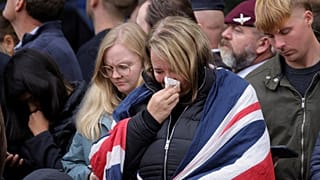 People get emotional as the procession starts on the day of the Queen Elizabeth II funeral